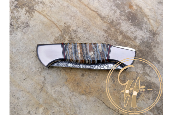 damasteel_vinland_backlock_foding_knife_grey_mamoth_tooth_handle_titanium_bolster