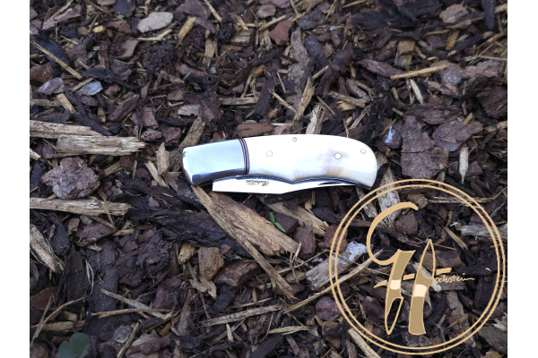trapper_rwl-34_stainless_steel_63hrc_warthog_tusk_titanium_slipjoint_leather_sheat_1